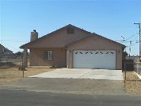 Lots of tile and a fireplace in this Hesperia home 4
