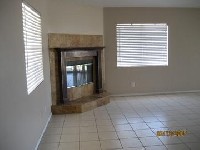 Lots of tile and a fireplace in this Hesperia home 5