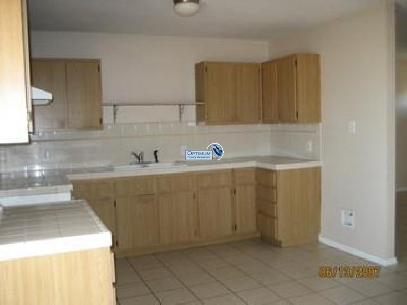 Lots of tile and a fireplace in this Hesperia home 3